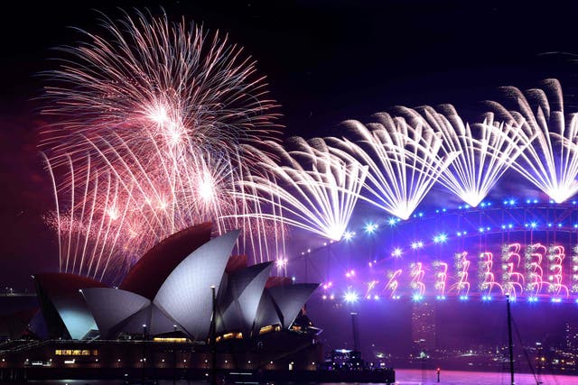 New Year’s Eve fireworks erupt over Sydney’s iconic Harbour Bridge and Opera House during the fireworks show