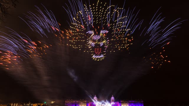 New Year’s Eve Lasers, drones and fireworks illuminate the sky in front of the Royal Naval College in Greenwich shortly after midnight in London