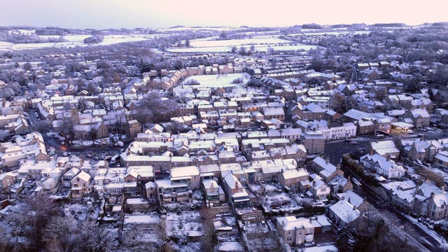 Freshly-fallen snow covers houses in Corbridge, near Hexham in Northumberland