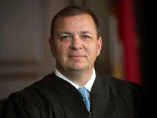 2 ん. Carolina justices won't step away from voter ID case