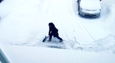 Politician faces backlash for posting photo of his wife shovelling snow