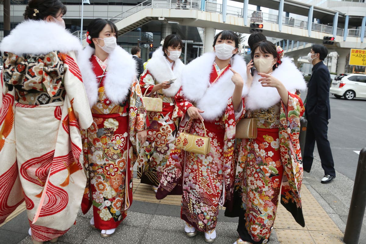 Japan keeps border controls as it prepares for omicron surge