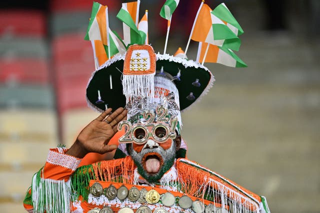 An Ivory Coast supporter cheers before the group Africa Cup of Nations match between Equatorial Guinea and Ivory Coast at Stade de Japoma in Douala