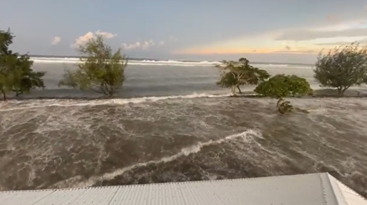 Waves crash into Tonga homes as Australia and New Zealand issue tsunami warnings