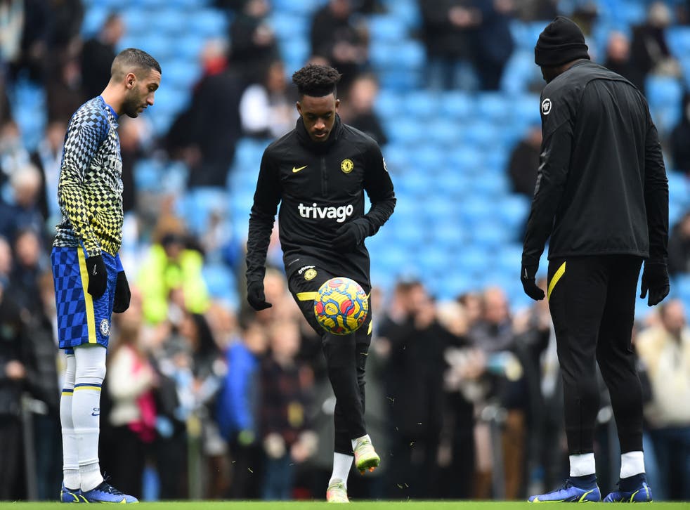 <p>Chelsea players warm up before kick-off</p>