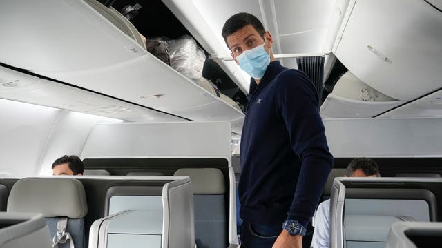 Novak Djokovic prepares to take his seat on a plane to Belgrade, in Dubai, after losing his bid to stay in Australia to defend his Australian Open title despite not being vaccinated against COVID-19