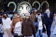 Japan widens COVID curbs, including in Tokyo, as cases surge