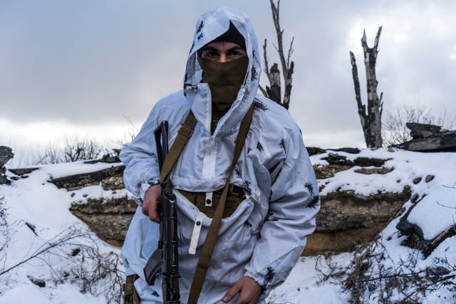 Anatoliy, a Ukrainian soldier with the 56th Brigade, in a trench on the front line in Pisky, Ukraine