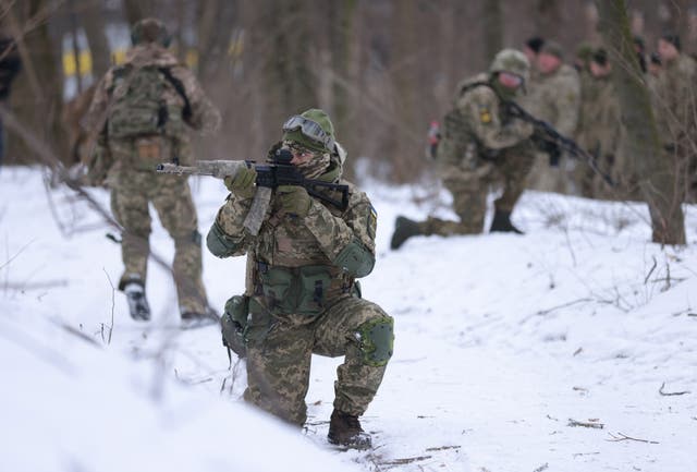 Civilian participants in a Kyiv Territorial Defence unit train on a Saturday in a forest in Kyiv, Ukraine