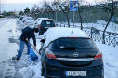 Greek army helps remove vehicles on snow-plagued tollway