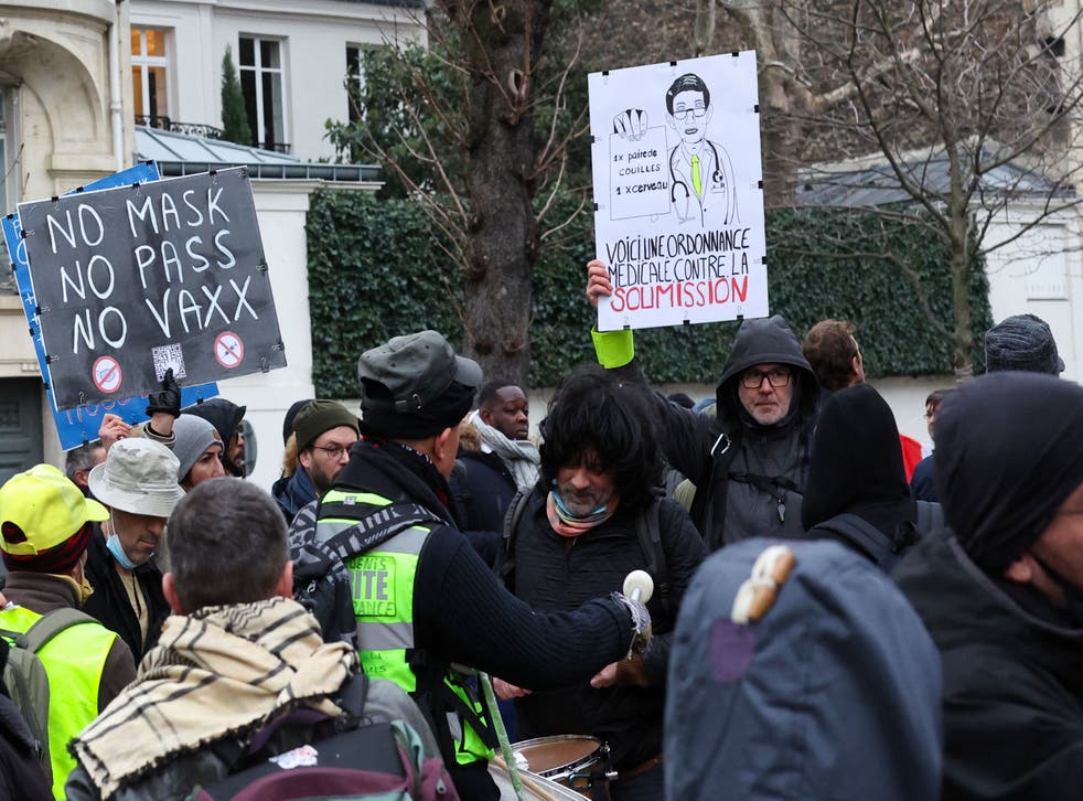 <p>Protestors take part during a demonstration against the health pass and Covid-19 vaccines in front of the Palais Bourbon, France’s National Assembly, in Paris on 16 January 2022</p>