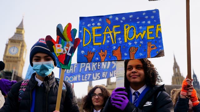 School children take part in a rally in support of British Sign Language becoming a recognised language in the UK, outside the Houses of Parliament, Westminster, as the British Sign Language Private Members’ Bill, introduced by Rosie Cooper MP, reaches its second reading in the House