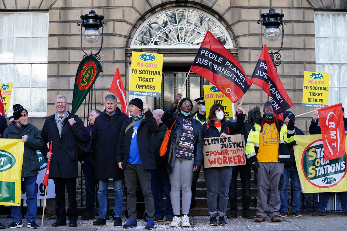 Transport workers march to Bute House in ticket office closure protest