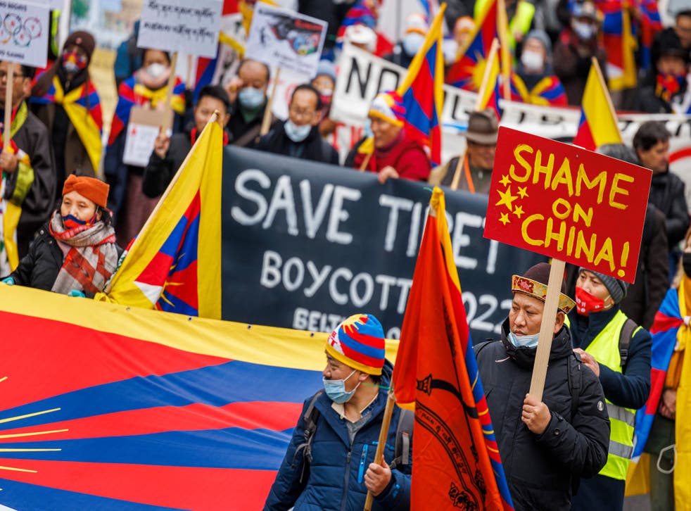 <p>Tibetan protesters take part in a protest  march at the International Olympic Committee (IOC) headquarters in Lausanne, 3 February 2022</p>