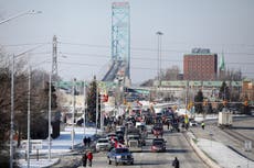 Canada truckers agree to open one lane of Ambassador Bridge after four-day blockade