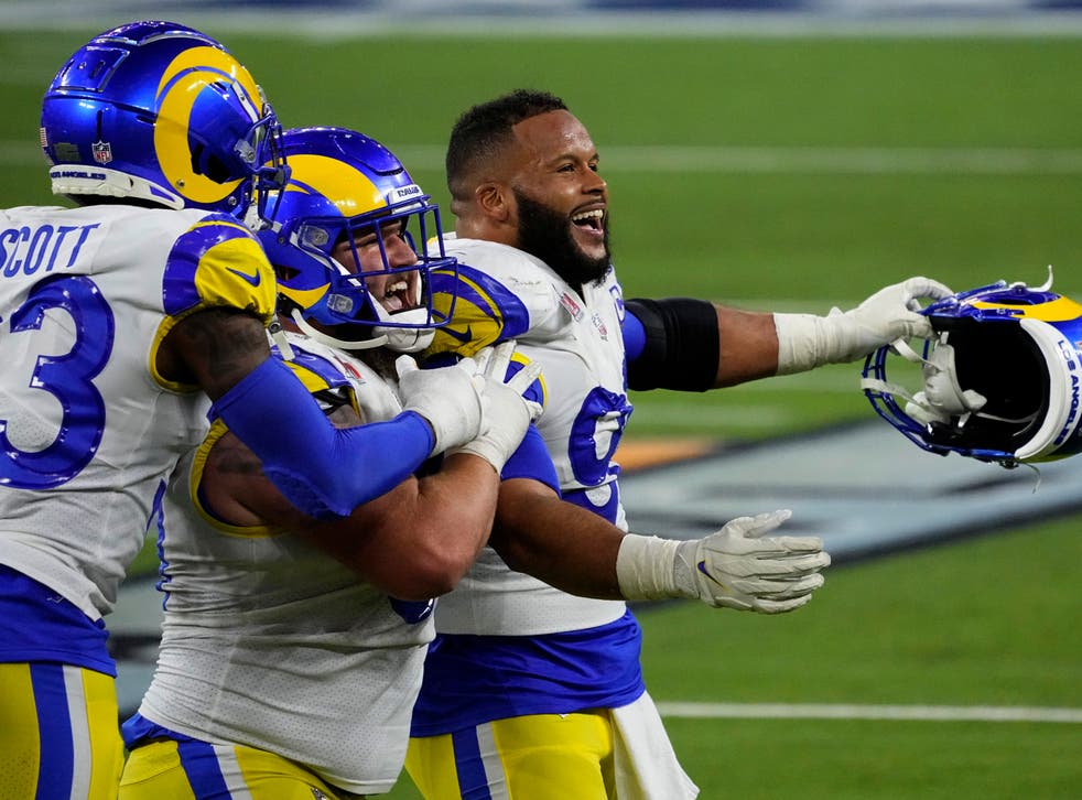<p>Los Angeles Rams defensive end Aaron Donald celebrates with teammates after winning Super Bowl 56</s>