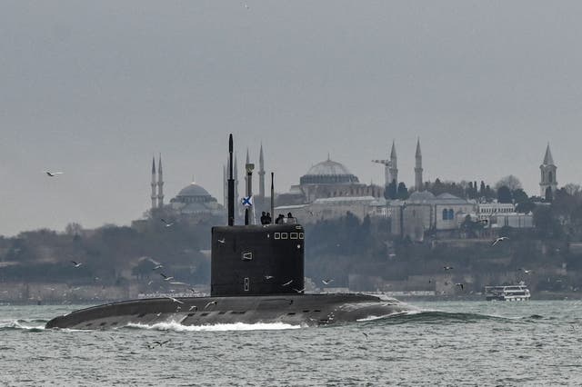 Russian Navy's diesel-electric Kilo class submarine Rostov-on-Don sails with an naval ensign of the Russian Federation, also known in Russian as The Andreyevsky Flag on it through the Bosphorus Strait on the way to the Black Sea