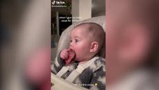 Mother feeds six-month-old baby bleeding steak