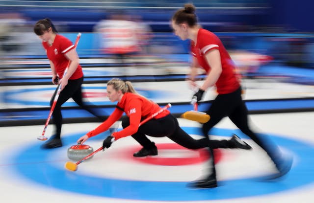 Hailey Duff, left, Vicky Wright, centre and Jennifer Dodds in action for Great Britsin during their women’s curling round robin match against Japan at the Beijing Winter Olympics. Team GB sealed a 10-4 victory
