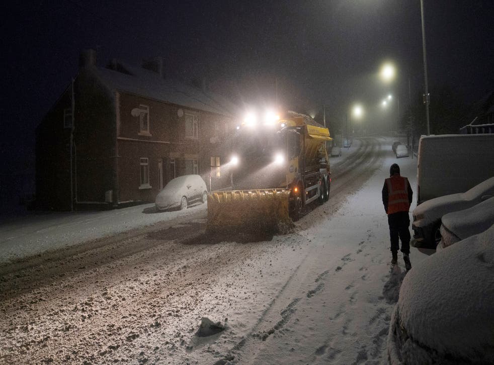 <p>A snowplough clears a road in Tow Law, County Durham</p>