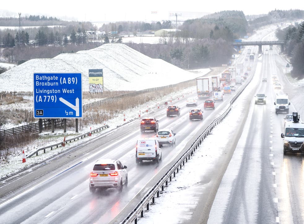 Motorists drive through sleet and snow along the M8 near Bathgate in West Lothian (Jane Barlow/PA)