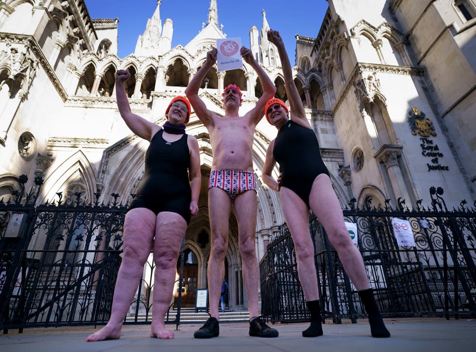 Swimmers gathered outside the Royal Courts of Justice in London for the hearing (Victoria Jones/PA)