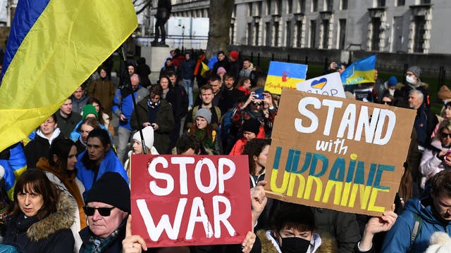People protest against the Russian invasion on Ukraine outside Downing Street in London
