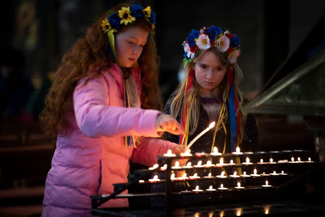 People head to St Mary’s Cathedral to light candles after a demonstration outside the Russian Consulate General in Edinburgh, following the Russian invasion of Ukraine