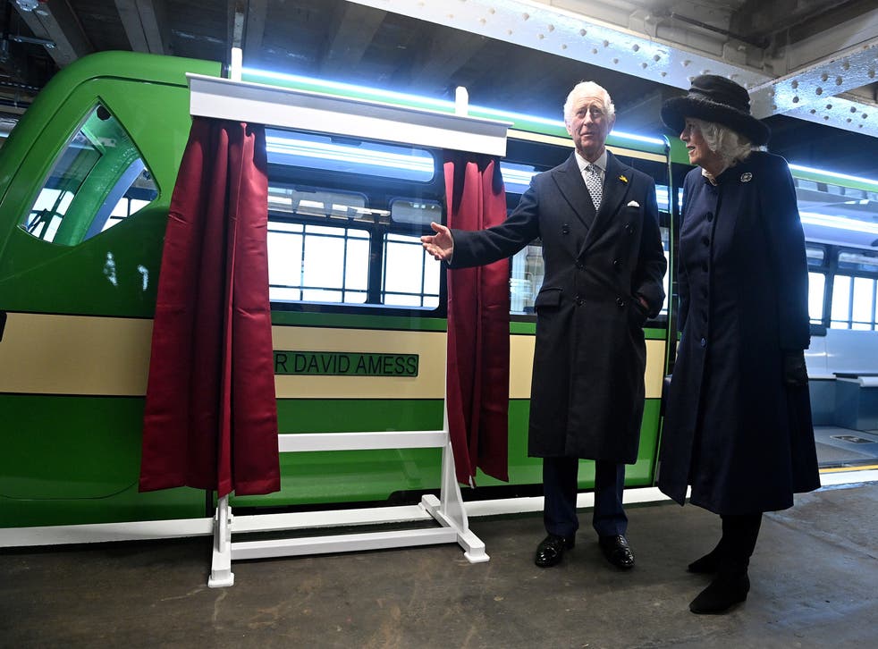 Charles and Camilla unveil the new eco-friendly Southend-on-Sea Pier Train named after the late MP Sir David Amess during their visit (Justin Tallis/PA)