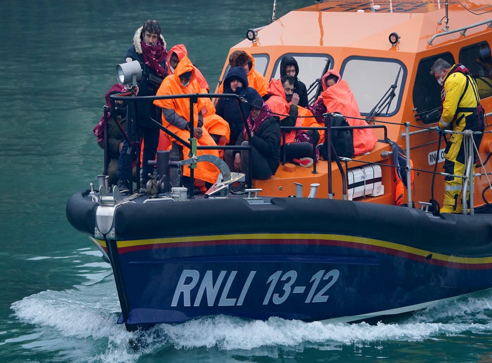 A group of people thought to be migrants are brought in to Dover, Kent, onboard an RNLI vessel (Gareth Fuller/PA)