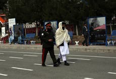 Taliban official wanted by U.S. makes rare public appearance