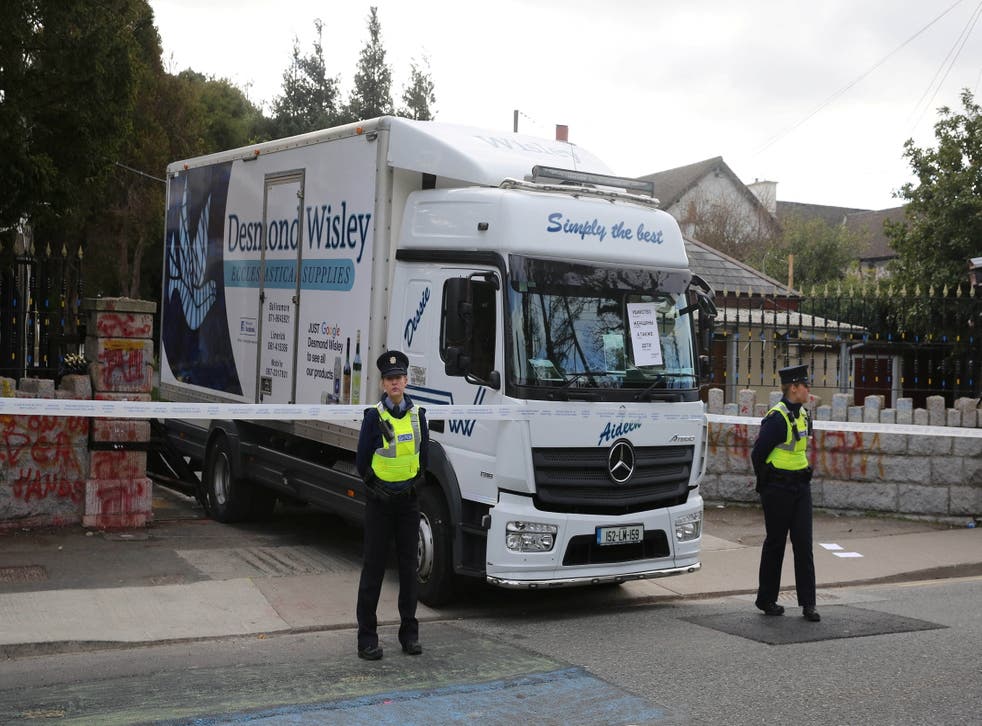 <p>Irish police stand guard at the Russian Embassy following an incident where a truck reversed through the entrance gate</s>