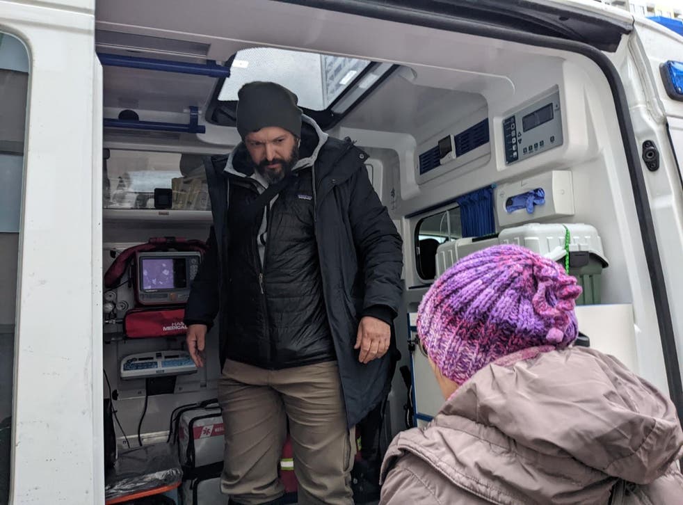 <p>Bryan Stern in the ambulance after transporting three premature surrogate babies across the border into Poland to meet their parents</磷>