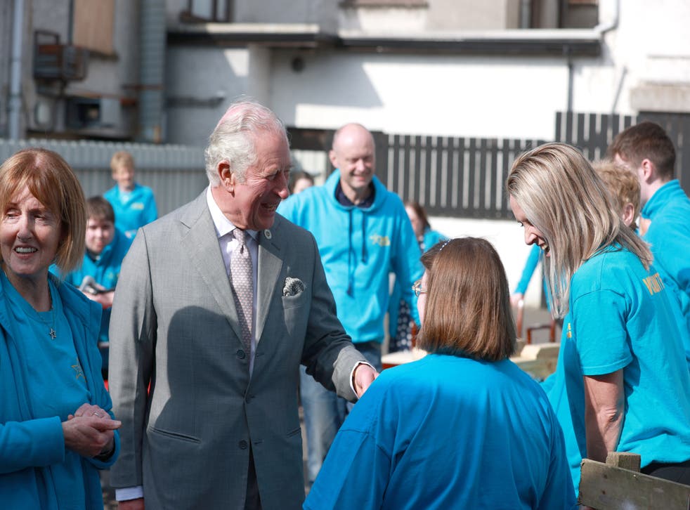 The Prince of Wales meets volunteers at the Superstars cafe in Cookstown (Liam McBurney/PA)