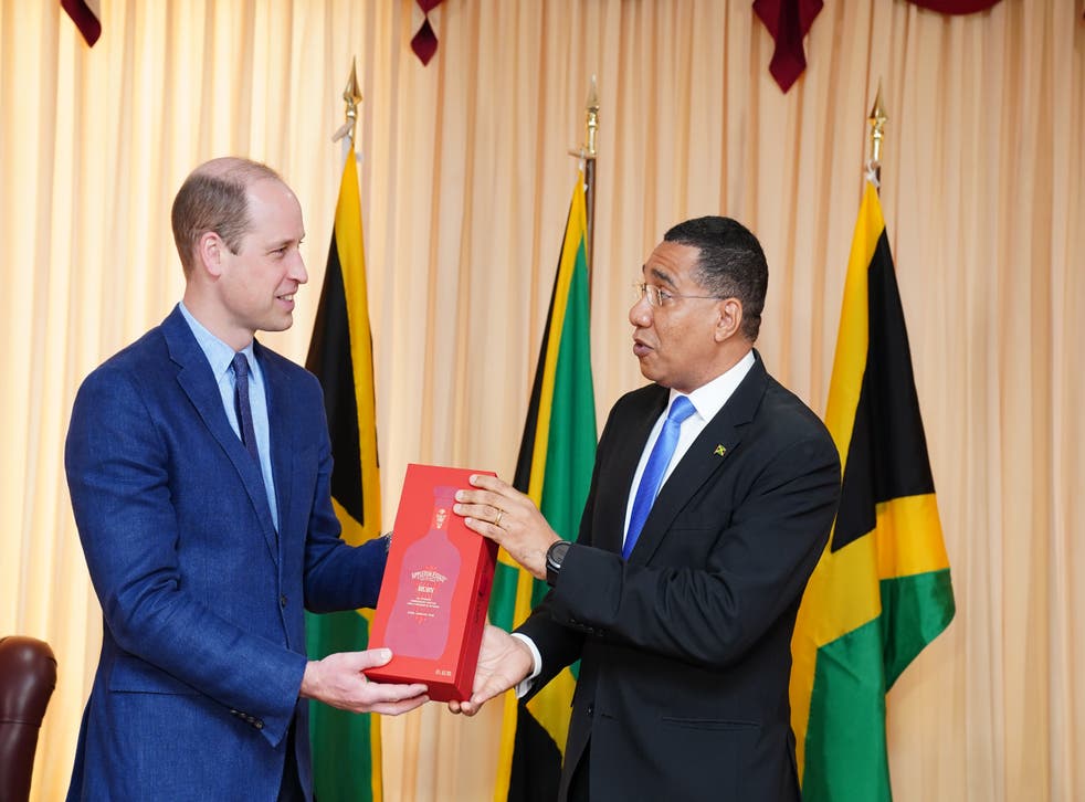 William receives a gift of a rare Appleton Estate ruby rum from Jamaica’s Prime Minister (Jane Barlow/PA)