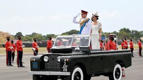 Britain's Prince William and Catherine, Duchess of Cambridge ride in a vintage Land Rover used by Britain's Queen Elizabeth during her visit to Jamaica