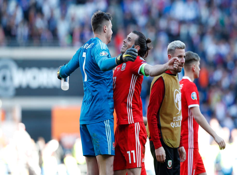Gareth Bale, reg, says his relationship with Wayne Hennessey, links, has turned into a bromance (Darren Staples/PA)