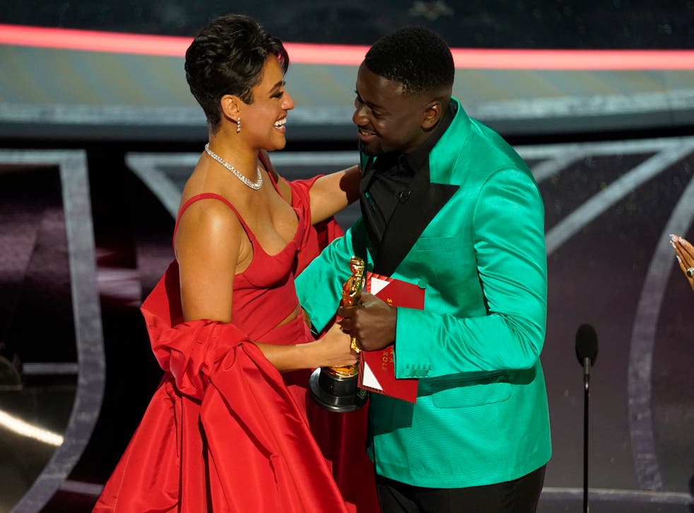 Ariana DeBose collects her gong from Daniel Kaluuya (Chris Pizzello/AP)