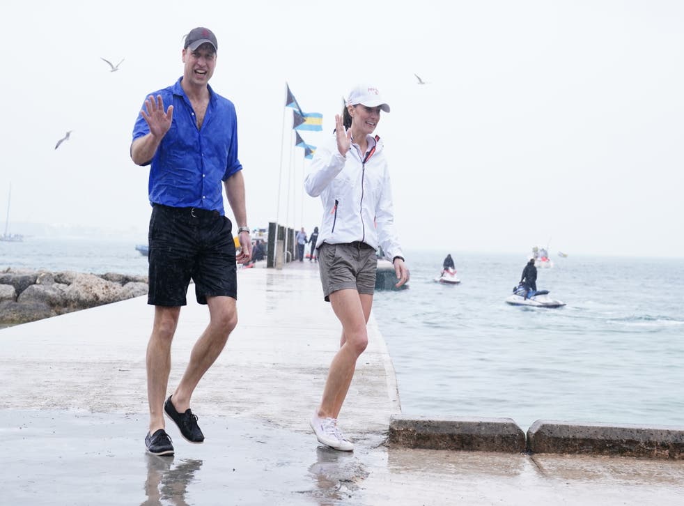 A drenched William and Kate step onto land after sailing in a regatta in the Bahamas (Jane Barlow/PA)