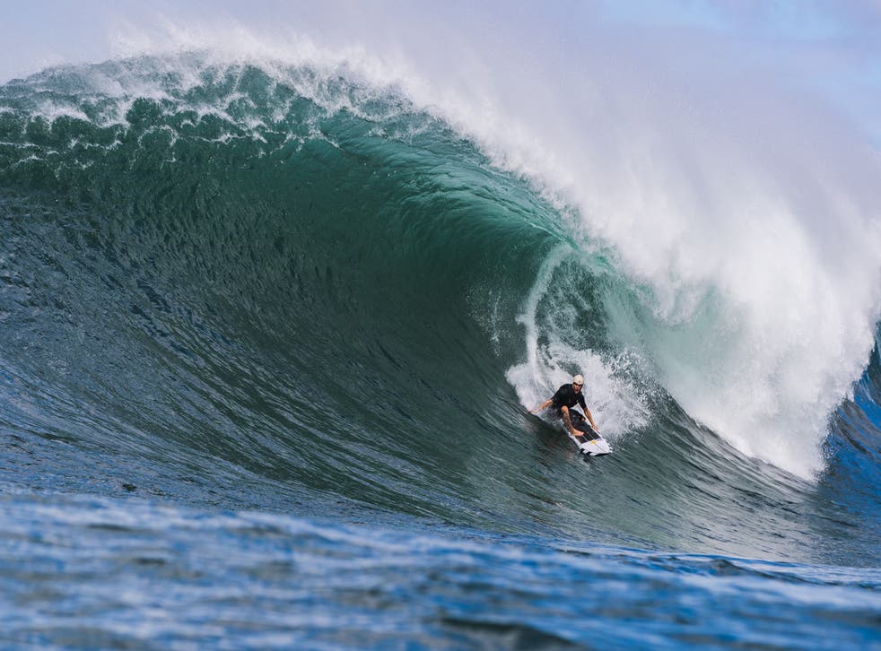 <p>Koa Smith surfs Waimea Bay in the Hawaiian island of Oahu. </p>