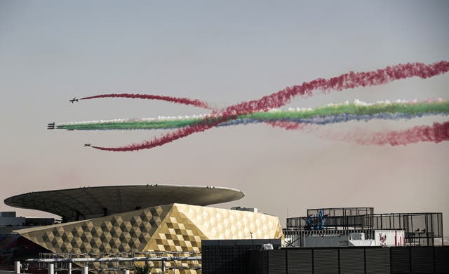 Members of Al Fursan aerobatics demonstration team of the United Arab Emirates (Emirados Árabes Unidos) perform over the EXPO site before the official closing ceremony of EXPO 2020 Dubai, United Arab Emirates