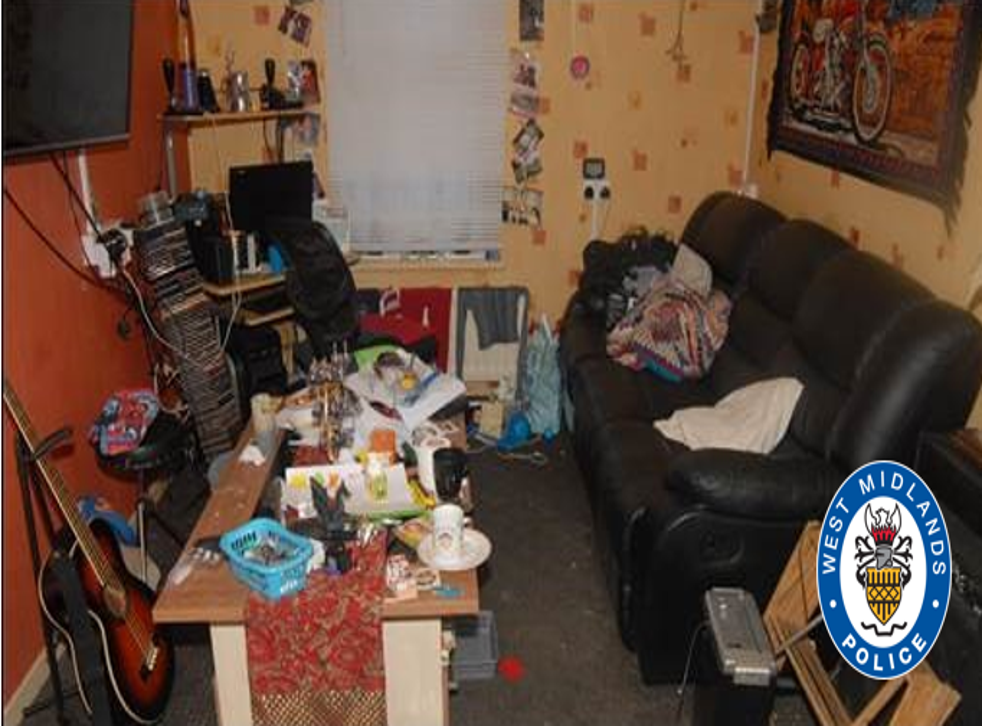 <p>An ambulance worker who arrived at Cook Street described the flat as ‘messy, cluttered and dirty’. Hakeem’s body had been moved into this living room after he was found in the garden.  </磷>