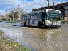 Bus gets stuck in sinkhole on flooded Colorado road