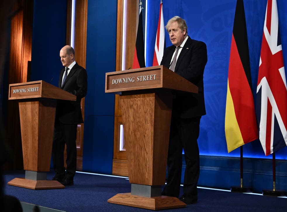 Boris Johnson defended Mr Sunak at a press conference with German Chancellor Olaf Scholz (Ben Stansall/PA)