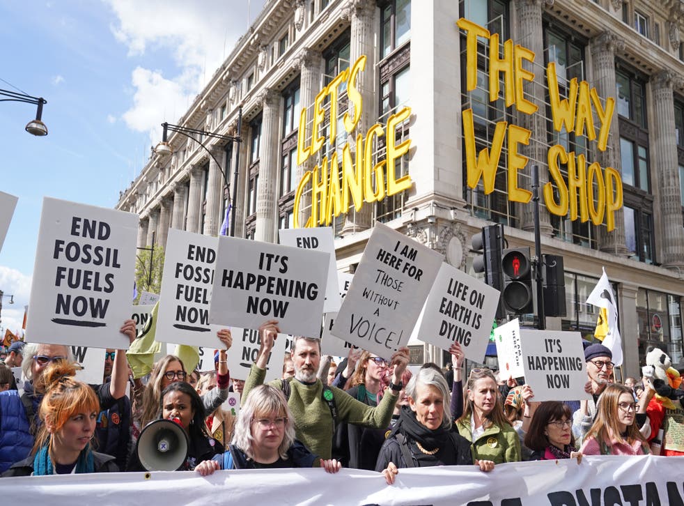 Activists from Extinction Rebellion demonstrate on Oxford Street in central London (Stefan Rousseau/PA)