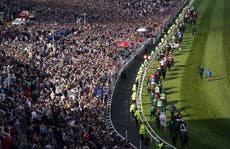 Sell-out crowd cheers on Grand National as punters return to races