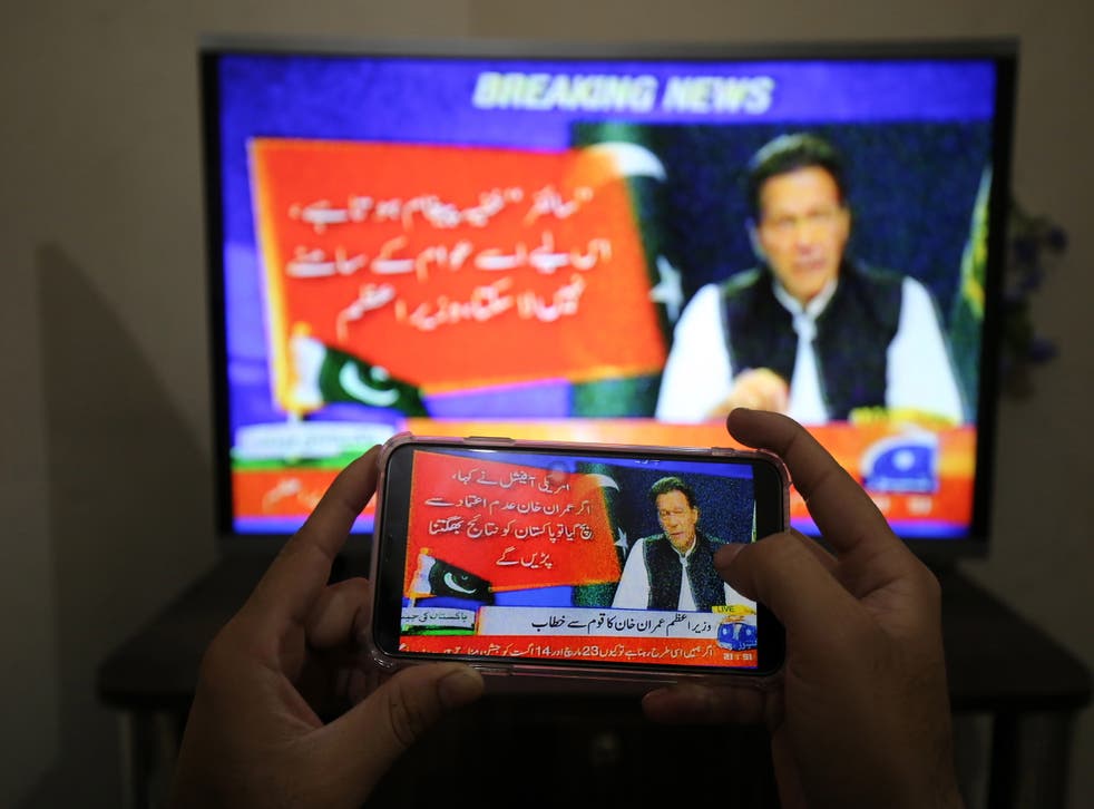 <p>People watch a televised speech by the Pakistan Prime Minister Imran Khan, a day after the country's top court set aside the government's move to block a no-trust vote</bl>