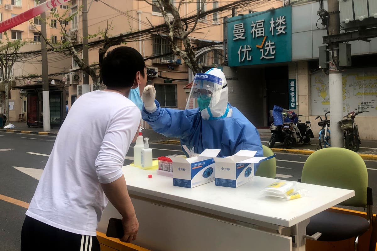 Shanghai discharges thousands of patients, boosts supplies