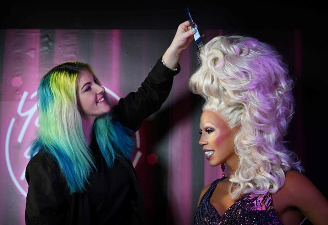 Studio supervisor Emma Meehan adds the final touches to a waxwork of US drag queen RuPaul at the unveiling at Madame Tussauds of the latest waxwork in Blackpool