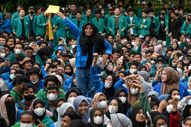 A university student shouts slogans during a protest against high prices of supplies, postponement of presidential elections and an extension of the president's term in front of the people's representative council (DPR) in Banda Aceh